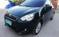Selling Black Mitsubishi Mirage 2014 at 26000 km