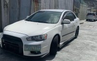 White Mitsubishi Lancer 2010 for sale in Quezon City